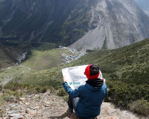 Trekker With Map At Manaslu Trekking